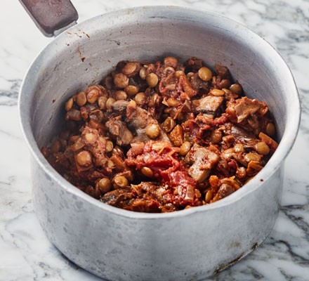 Tomato and lentil ragu in saucepan